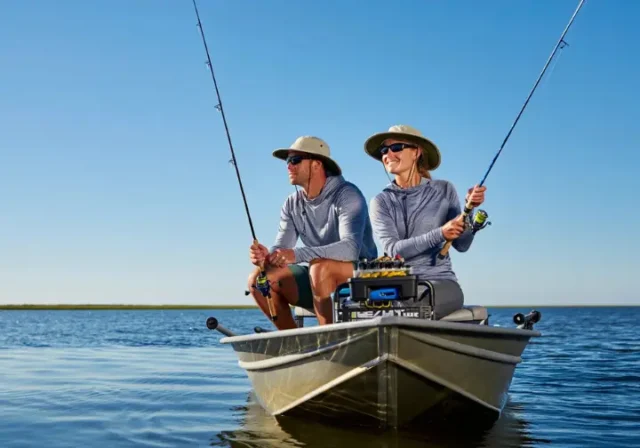 Two anglers fishing comfortably and protected in smart fishing clothes, enabling them to fish longer.