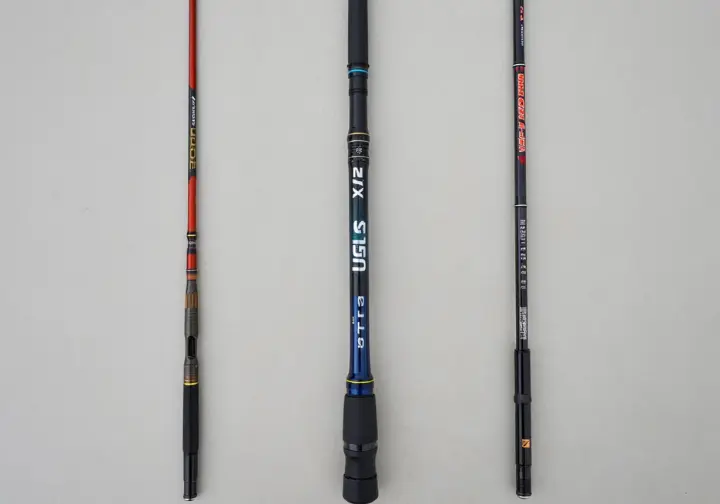 Comparison showcase displaying the Ugly Stik GX2 fishing rod alongside key competitor rods like the Fenwick Eagle and Berkley Lightning Rod.