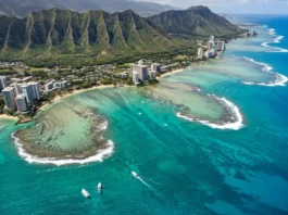 Aerial view of Oahu's fishing spots, including shorelines, piers, and deep-sea charters, with anglers and marine life.