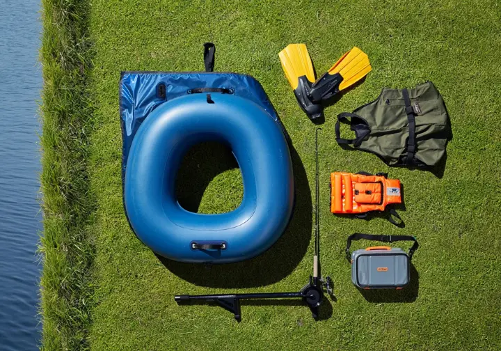 Overhead view showing essential gear for float tube fishing laid out neatly, illustrating understanding the basics.