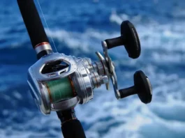 Tough saltwater fishing rod and reel enduring salt spray on a boat, built tough for the ocean.