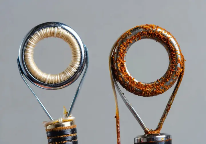 Comparison showing a clean, corrosion-resistant rod guide next to a rusted one, illustrating saltwater rod essentials.