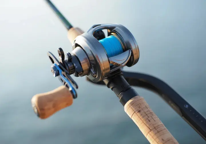 Close-up of a balanced saltwater fishing setup showing the reel seated on the rod with line through the guide.