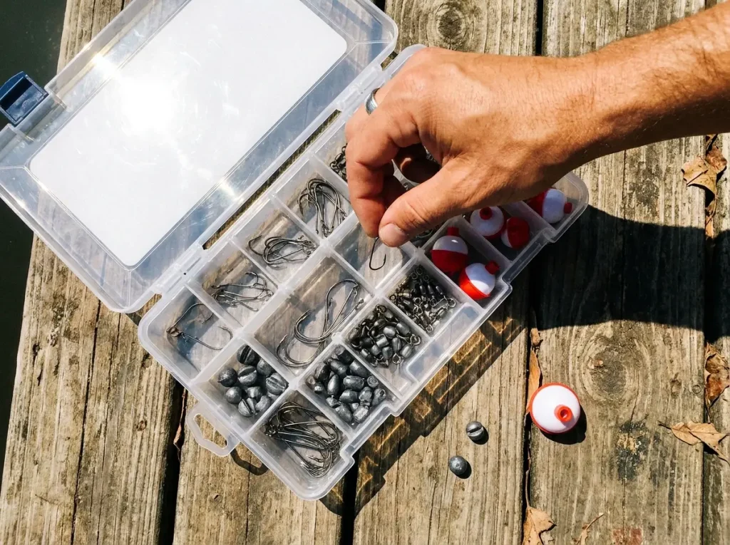 Open beginner tackle assortment of hooks, bobbers, sinkers and swivels for terminal tackle