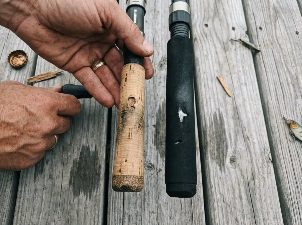 Cork and EVA foam fishing rod grips compared side by side on a wooden dock