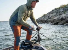 Best Trolling Motor Battery: 2026 Runtime & Buyer Guide Angler using a trolling motor to fight heavy wind and current on a lake.