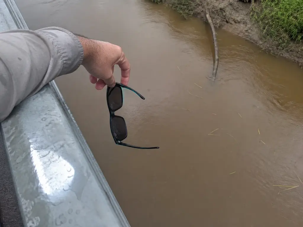Stained brown water after rain where polarized lenses cannot restore visibility