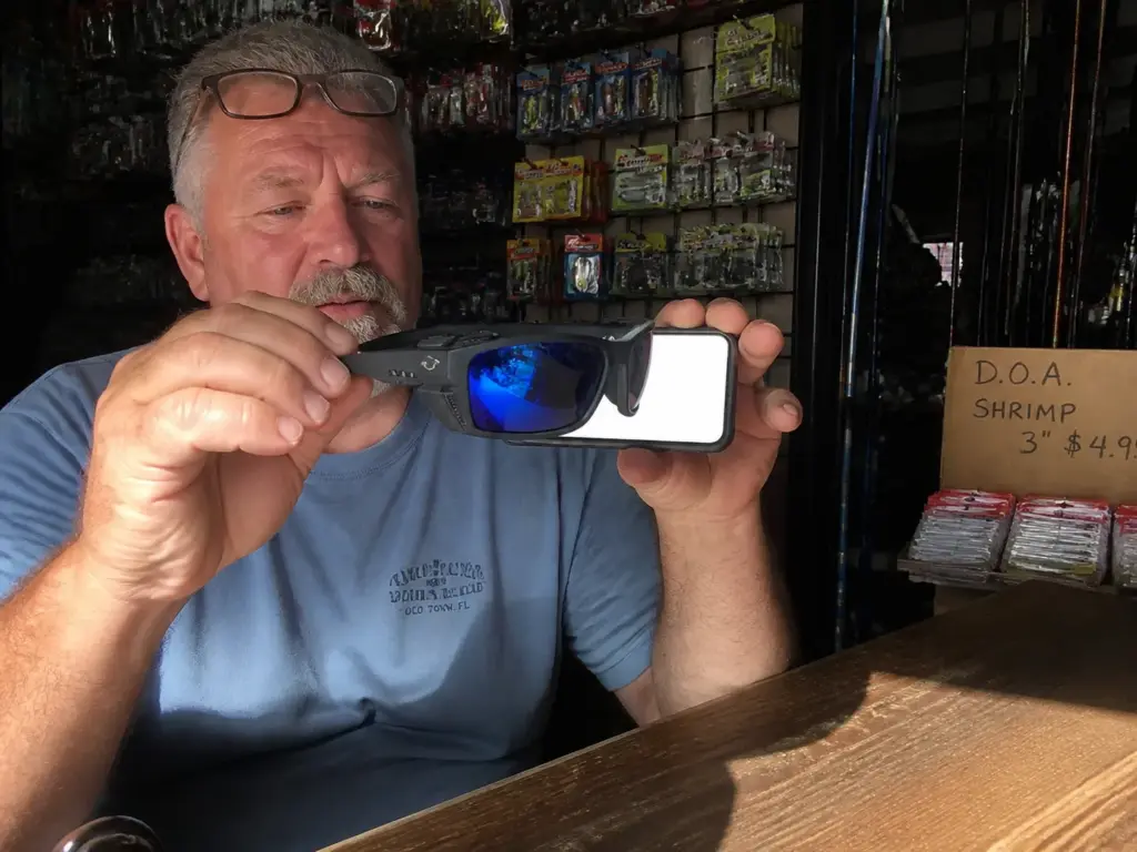 Running the blackout test on polarized sunglasses against a phone screen before buying