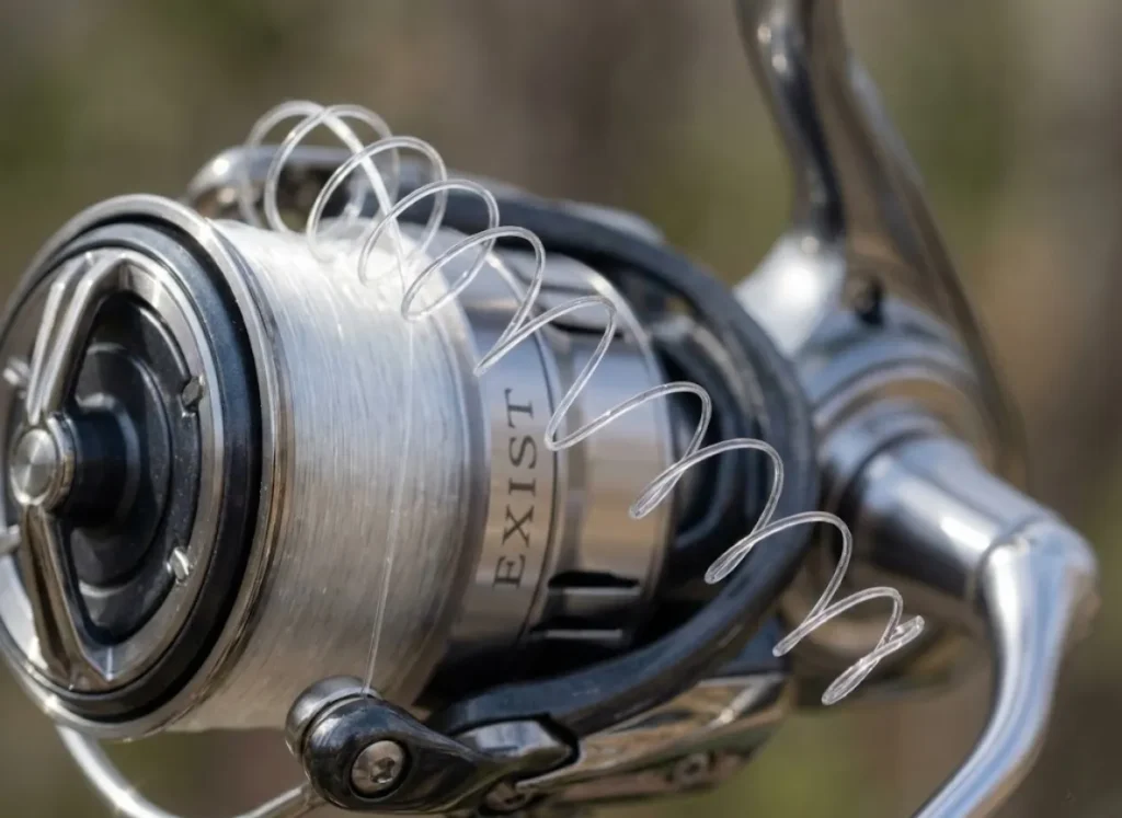 Macro close-up of Seaguar fluorocarbon line showing helical memory coils coming off a Daiwa Exist reel.