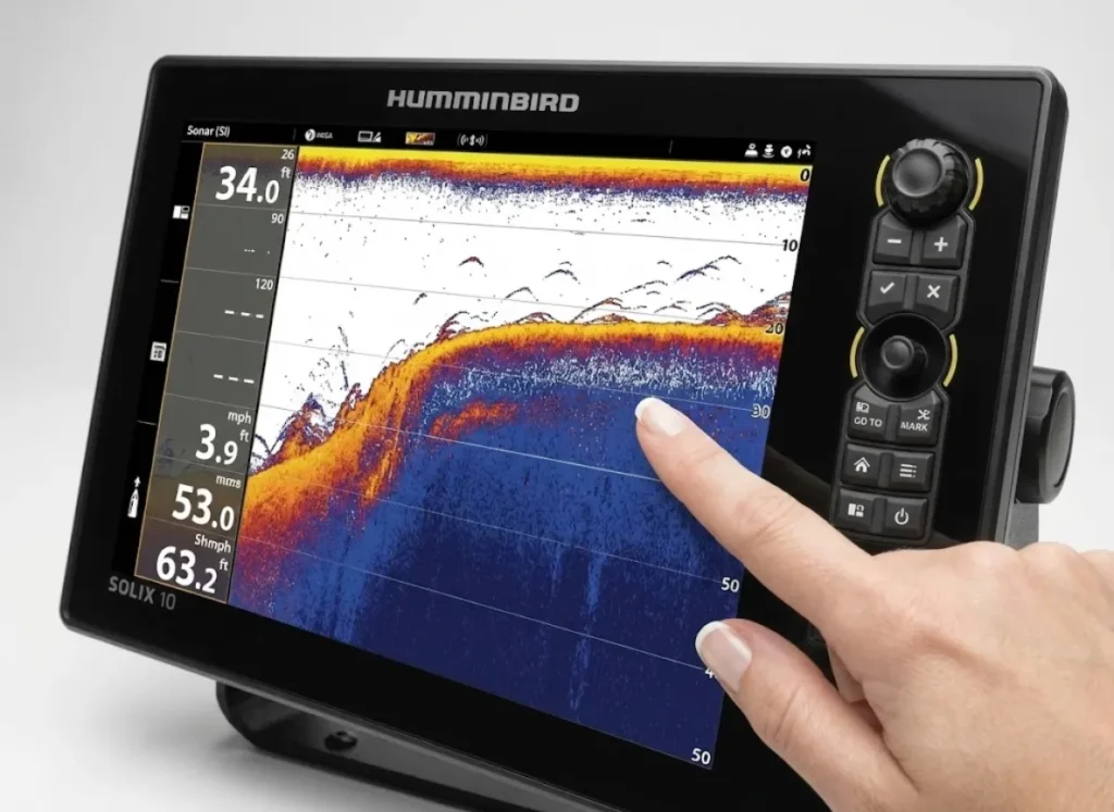 Macro photography of a Humminbird fish finder screen displaying a clear thermocline layer on 2D sonar.