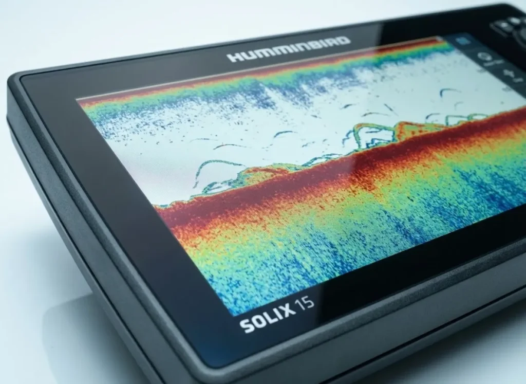 Close-up of a high-tech Humminbird fish finder screen displaying a distinct thermocline layer, illustrating the oxygen-temperature squeeze in deep water.