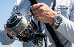 Reel Drag Systems Heat Physics: Data-Backed Analysis A Shimano Stella SW spinning reel emitting heat waves while a fisherman in a Columbia PFG shirt fights a large tuna.