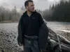Merino vs Synthetic Fishing Base Layer System Angler in a merino base layer under an open wading jacket at a cold river before fishing