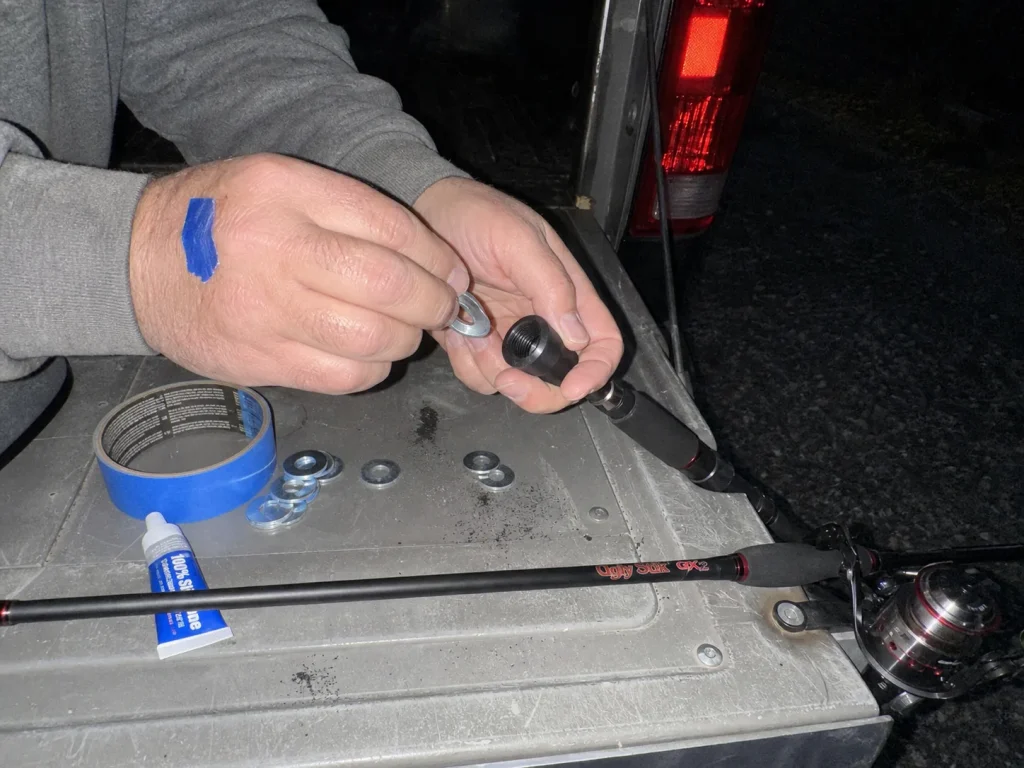 Washers loaded into a rubber butt cap as a removable counterweight to balance a rod