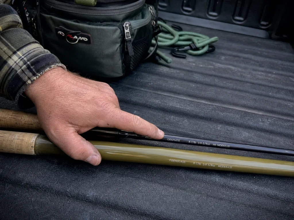 Two rod blanks side by side, a thin graphite rod and a thicker fiberglass rod, showing material differences