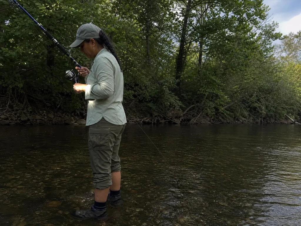 Angler holding a rod tip-up working a finesse rig, showing technique changes rod balance