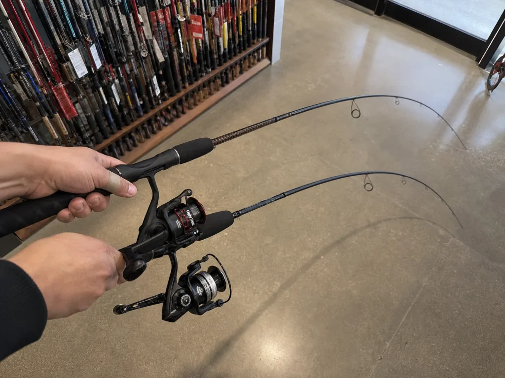 Two rods both labeled medium held side by side flexing differently to show brand rating inconsistency