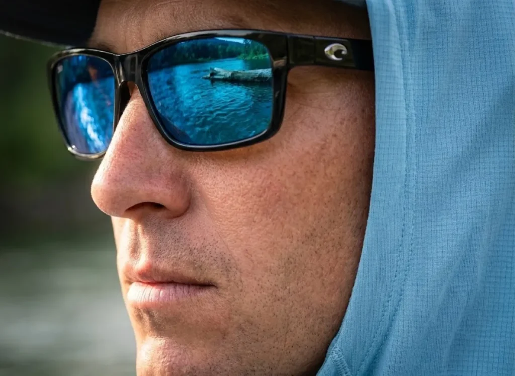 Extreme close-up profile of an angler wearing Costa sunglasses, demonstrating the intense visual focus of the Quiet Eye technique.