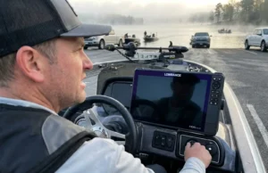 Dead Boat Battery Spring? Here’s What Went Wrong Last Fall Angler turning key on bass boat with dead battery at spring boat ramp