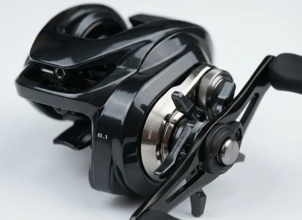 Macro studio photography of a pristine Shimano DC baitcasting reel, highlighting the machined aluminum texture and digital braking components.