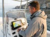 How to Fish Legally in Marine Protected Areas Angler checking GPS chartplotter for marine protected area boundaries on California coast