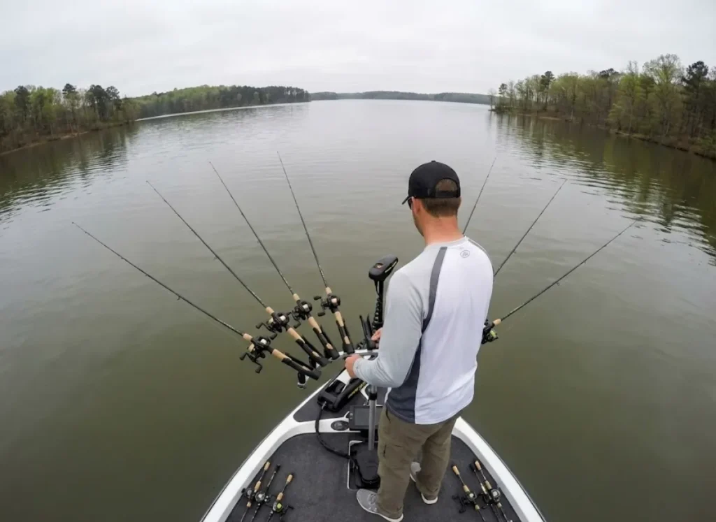 Angler spider rigging for pre-spawn crappie with multiple long rods on reservoir