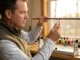 Rod Guide Materials Compared: SiC vs Alconite vs Hardloy (Price Tiers) Custom rod builder examining Fuji Torzite titanium guide ring on partially wrapped blank