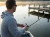What I Wish I Knew Before Fishing My First Dock Angler skip-casting a jig toward a wooden dock at sunrise on a calm lake