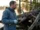 How to Flip and Pitch Bass Out of Heavy Cover (Step by Step) Angler flipping a jig into heavy cover on a bass fishing lake at dawn