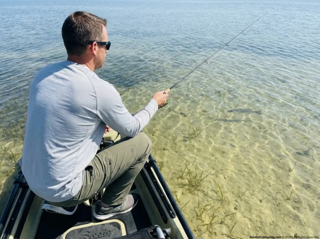 Angler sight-casting jerkbait on clear flat — stealth rigging with direct tie for pressured fish 