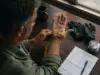 How to Size Fishing Gloves for Real Dexterity Angler measuring hand circumference with a soft tape for fishing glove sizing
