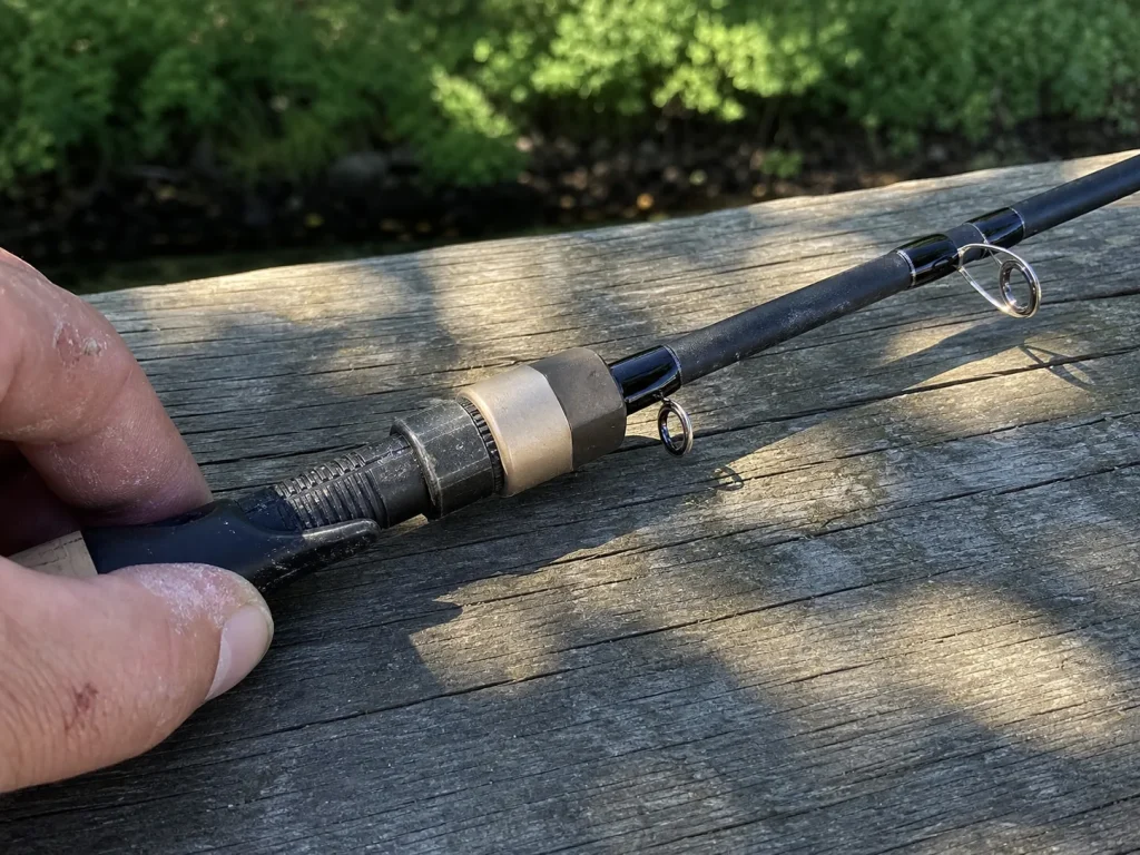Close-up of the guides and reel seat on a high-end casting rod showing component quality