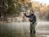 Best Fishing Spots in Arkansas Ozarks Most Anglers Miss Angler fly fishing Arkansas Ozarks White River tailwater morning mist