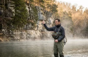 Best Fishing Spots in Arkansas Ozarks Most Anglers Miss Angler fly fishing Arkansas Ozarks White River tailwater morning mist