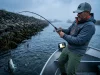 Sacramento Delta Striper Fishing When Tide Beats Season Angler fighting a striped bass while fishing the sacramento river delta for stripers.