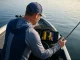 Deep Water Bass Tactics Most Anglers Never Learn Angler using forward-facing sonar on a bass boat over a deep summer ledge with bass visible on screen