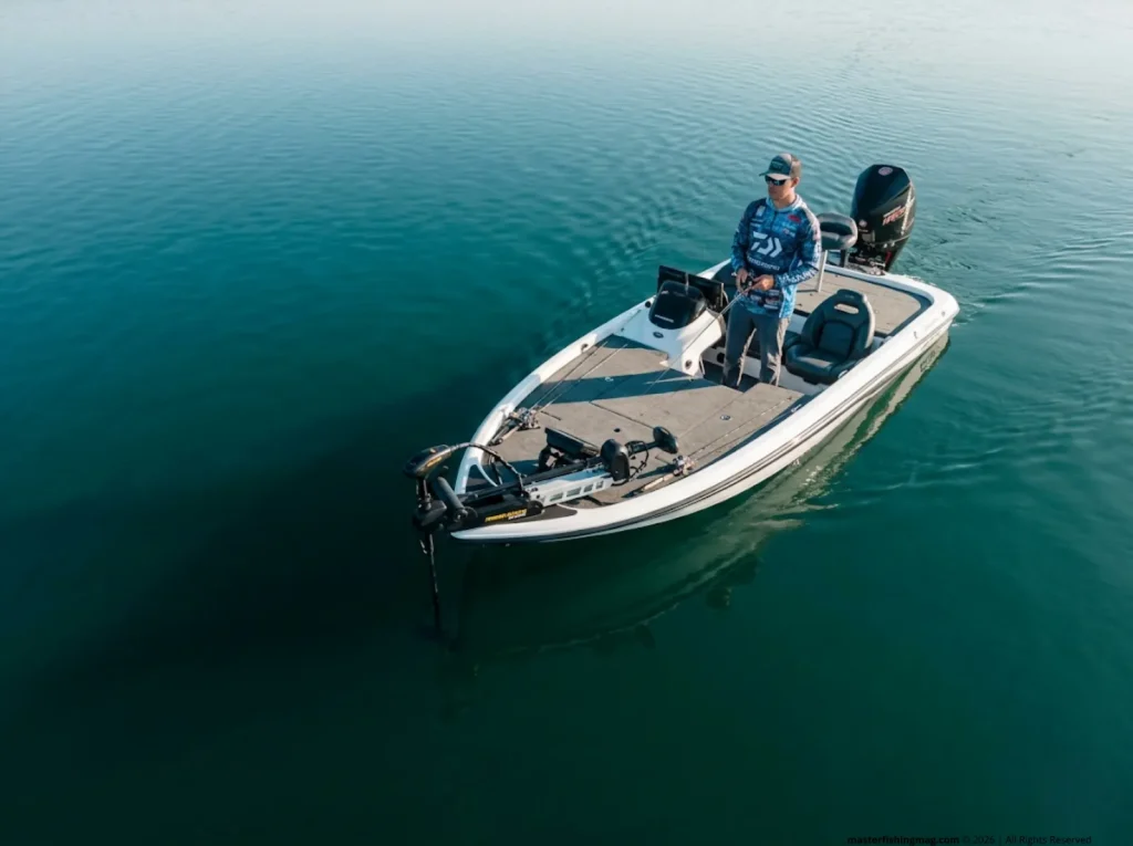 Angler using trolling motor to silently approach a deep bass school while studying forward-facing sonar