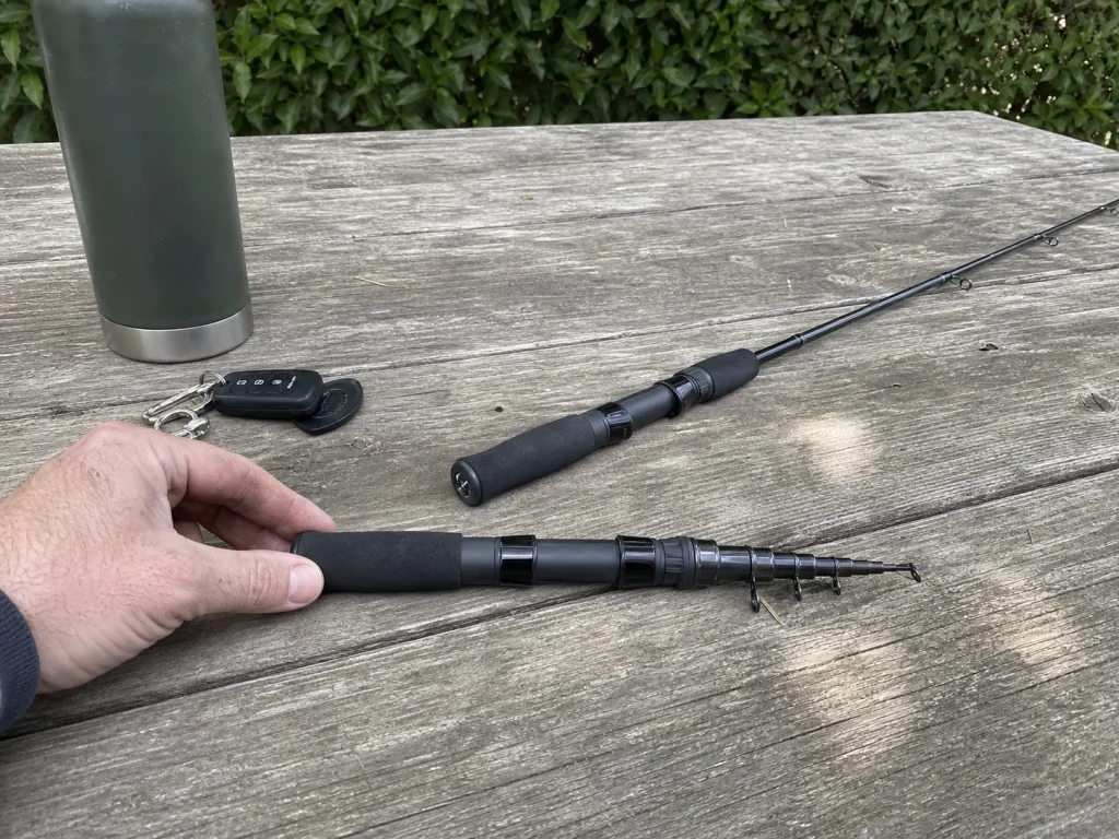 Close-up of a telescoping fishing rod collapsed to about eighteen inches next to its extended length