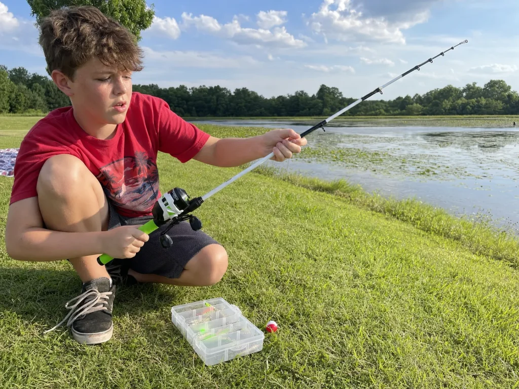 A young angler extending a Zebco Roam telescopic combo at a pond bank ready to fish in seconds