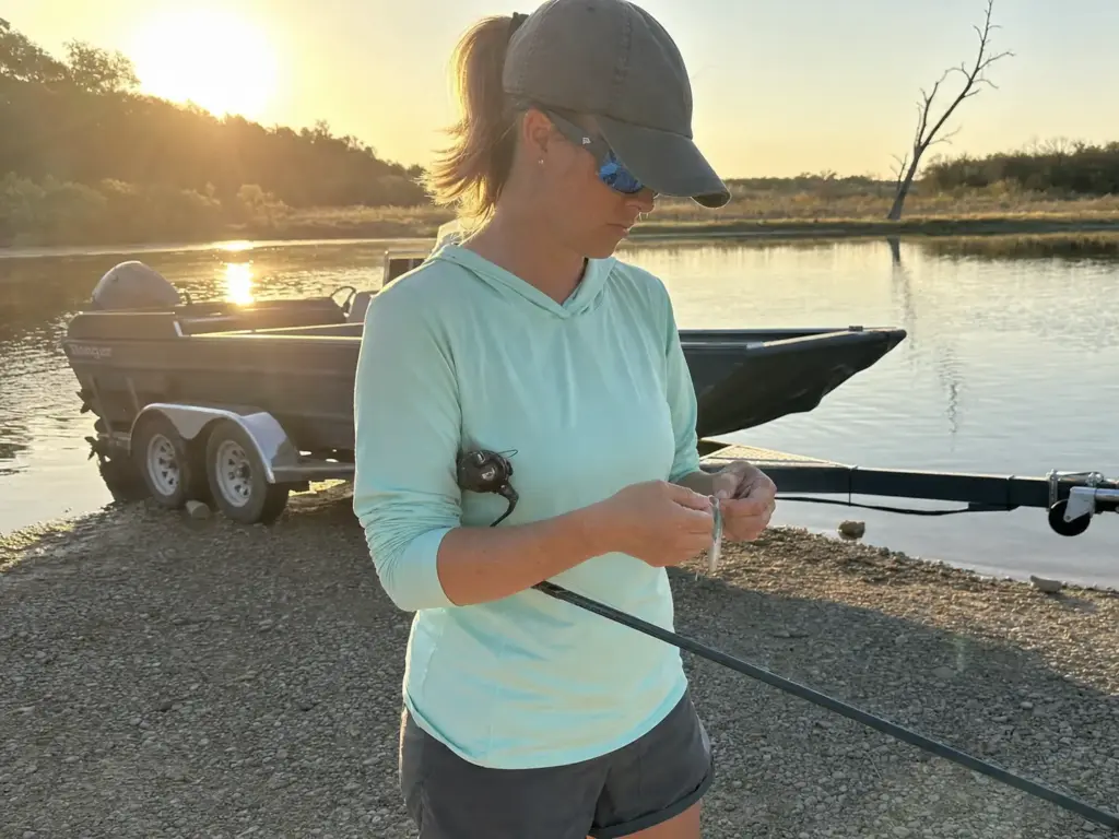 Angler wearing a single pair of polarized fishing sunglasses at the end of a long day on the water