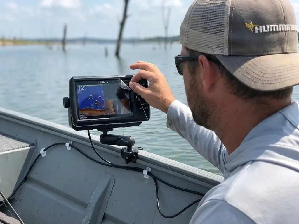 Garmin fish finder mounted on a RAM arm inside a jon boat