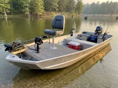 Why Most Jon Boat Setups Get the Order Wrong Modified jon boat with casting deck and fishing electronics on a lake