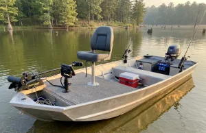 Why Most Jon Boat Setups Get the Order Wrong Modified jon boat with casting deck and fishing electronics on a lake