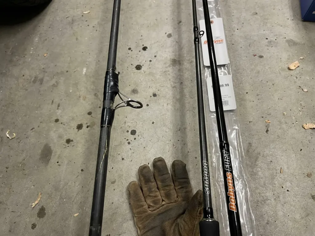 Badly damaged fishing rod next to a new rod still in wrapper showing replacement decision