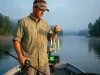 Alabama Rig vs Umbrella Rig Setup and State Laws Alabama rig with five swimbaits ready to cast from a bass boat at dawn