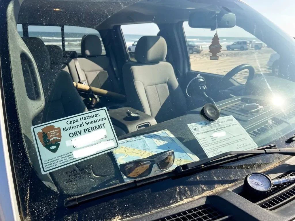 ORV permit displayed on windshield of 4WD truck at Cape Hatteras National Seashore beach ramp