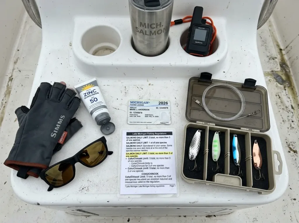 Fishing tackle and Michigan fishing license laid out on charter boat console