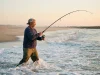 Why Most Surf Anglers Miss Striped Bass by 20 Feet surf-angler-casting-striped-bass-dawn