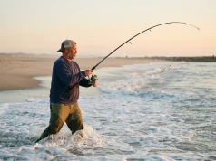 Why Most Surf Anglers Miss Striped Bass by 20 Feet surf-angler-casting-striped-bass-dawn
