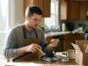 How to Set Up a Fishing Rod Without the Twist Beginner setting up a new spinning rod and reel combo on a kitchen table